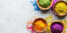 Bunte Farbtöpfchen – Symbol für individuelle Lösungen beim Zahnersatz